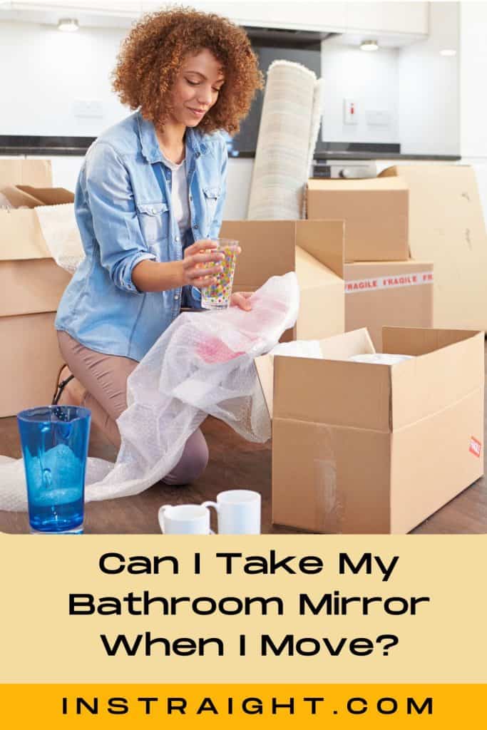 lady wondering Can I Take My Bathroom Mirror When I Move while packing up her things